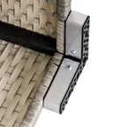 Close-up of the wicker table's metal support bracket and woven frame