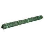 Rolled dark green artificial leaf hedge privacy fence panel with mesh backing