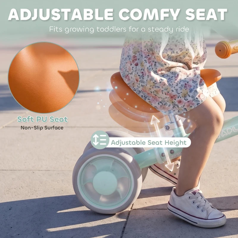 Adjustable padded PU seat on green toddler balance bike with four light-up EVA wheels