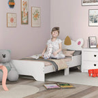 White unicorn toddler bed with low side rails and slatted base in a kids room