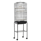 Black bird cage on wheeled stand with slide-out tray and two interior perches