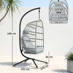Light grey hanging egg chair on X-shaped metal stand with padded seat cushion