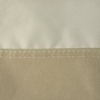 Close-up of beige and tan chair cover fabric with a double-stitched seam.