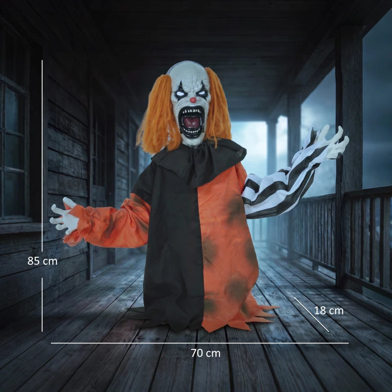 Halloween animatronic clown in black-and-orange robe with outstretched hands and glowing red eyes