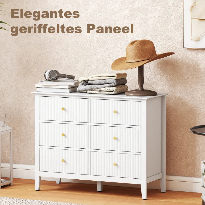 White fluted 6-drawer dresser with gold knobs and stacked drawer layout