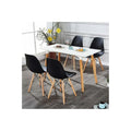 White rectangle dining table with four black molded ghost chairs