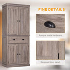 Kitchen pantry cabinet with antique metal hardware, recessed door panels, and wood grain