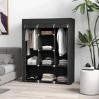 Black fabric wardrobe with hanging rails and shelves, open door with folded clothes inside.