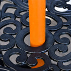 Base hardware close-up: orange-brown pole anchored on dark decorative stand