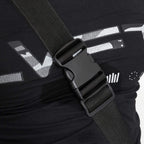 Safety belt strap and buckle on red/black inversion table, close-up