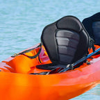 Black padded kayak seat with high backrest and gray cushions secured on watercraft