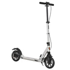 Silver folding kick scooter with shock-mitigating suspension and black handlebars.