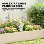 Wooden raised planter bed with blooming flowers and small garden figurine in center