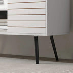 White striped cabinet lower panel of a TV storage unit with dark legs.