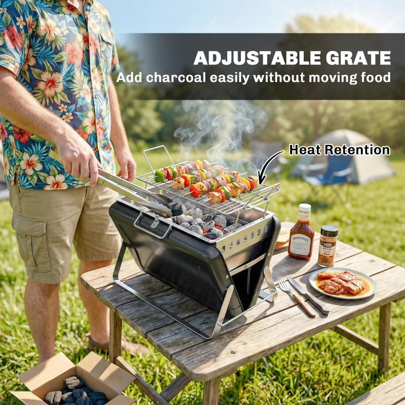 Black portable charcoal grill with adjustable grate over glowing coals