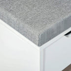 Grey fabric cushion corner on white shoe storage bench