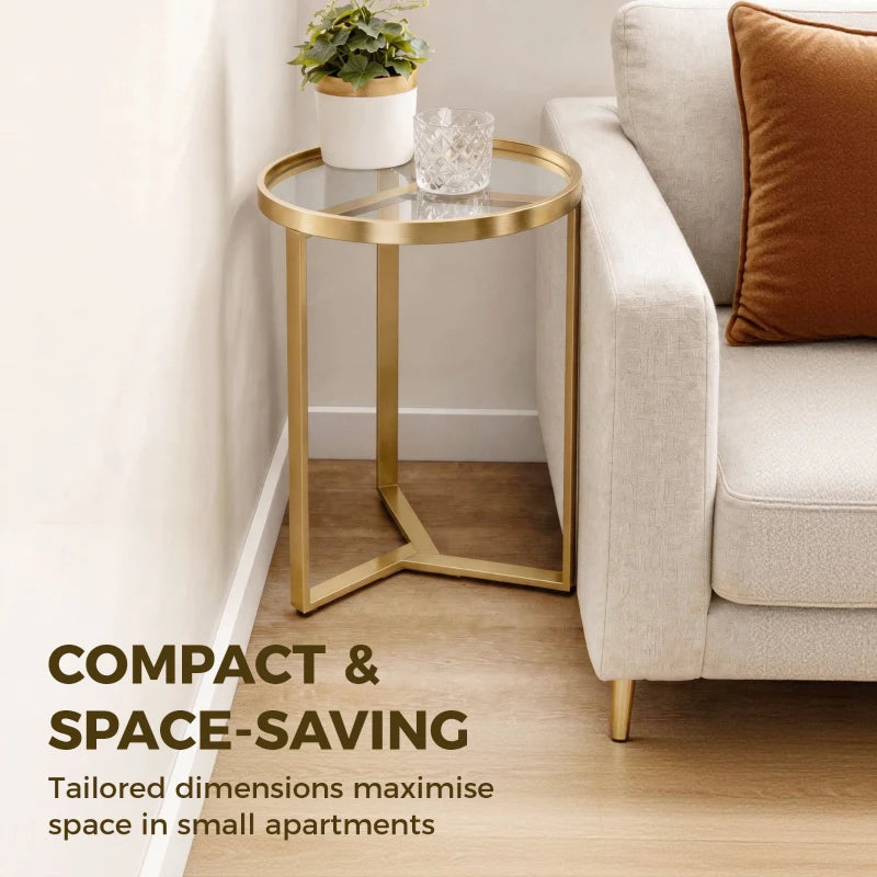 Gold round side table with clear glass top and open geometric base frame