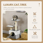 Grey cat tree tower with stacked plush condo and perches, sisal posts, and dangling toy