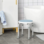 Light blue round shower stool with white frame and four grey non-slip feet.