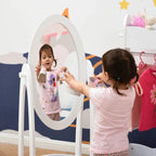 White child dressing mirror with oval reflective panel and side handles