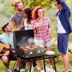 Black tabletop gas grill with open lid, two burners, and control knobs on front panel