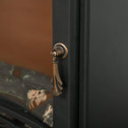 Black electric fireplace stove door handle with brass-look knob and keyhole