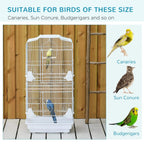 Large white metal bird cage with interior perches and feeding cups for small birds