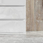 White high-gloss 5-drawer dresser corner view showing base and drawer sides