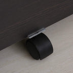 Caster wheel under dark wood-grain filing cabinet for smooth rolling