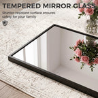 Black-framed tempered glass mirror, shown at an angled side view