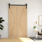 Black sliding barn door hardware track with rollers mounted above light wood double door