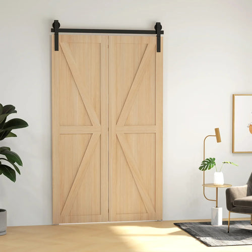 Black sliding barn door hardware track with rollers mounted above light wood double door