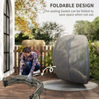 Folded hanging egg chair pod with grey mesh cover and black stand on patio.