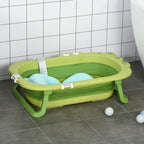 Green toddler bath tub with blue insert cushion and side support legs
