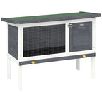 Grey wooden rabbit hutch with wire front and dark door, raised on white legs