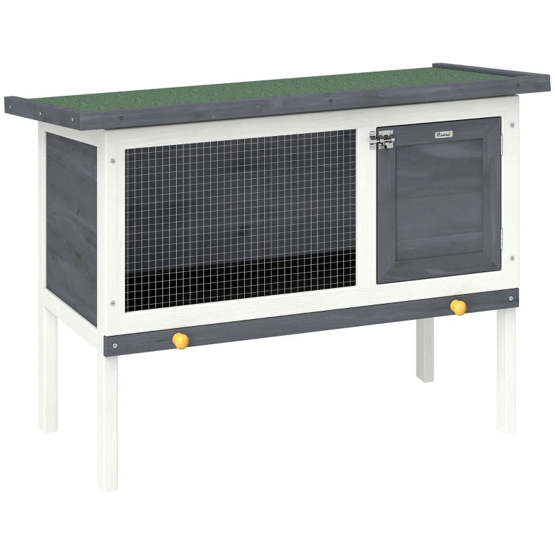 Grey wooden rabbit hutch with wire front and dark door, raised on white legs