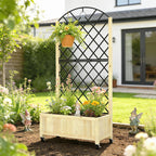 Wooden raised planter box with black diamond trellis holding potted flowers in the garden
