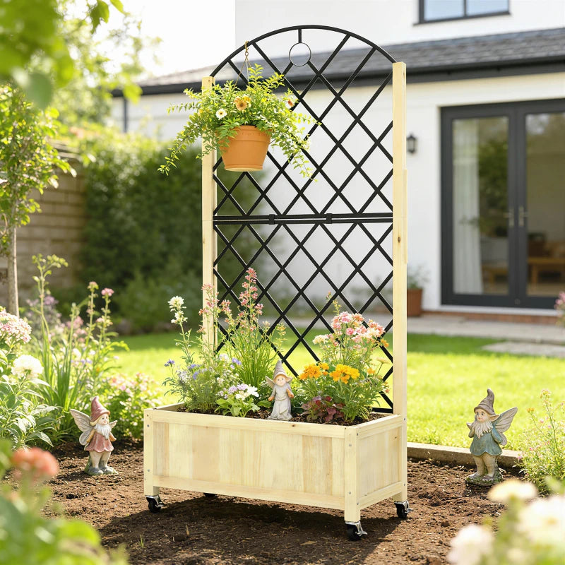 Wooden raised planter box with black diamond trellis holding potted flowers in the garden