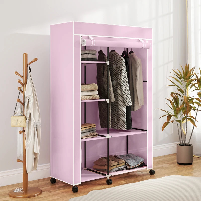 Pink folding fabric wardrobe with shelves and hanging rail, front view with hanging clothes.