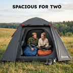 Dark grey two-person camping tent with red accents and open front doorway