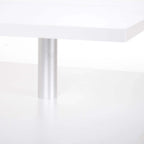 Aluminum leg detail on a white 2-tier coffee table with open shelf