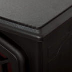Black electric fireplace stove top corner with textured finish and arched trim