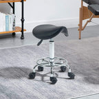 Black saddle stool with upholstered seat, chrome base, and rolling caster wheels