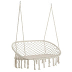 Cream hanging macrame hammock chair with oval net seat and fringe tassels