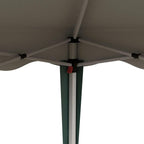 Underside view of green pop-up gazebo canopy showing central support bar