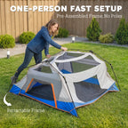 Blue and gray instant cabin tent with retractable frame, compact setup on grass