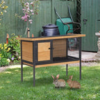 Elevated wooden pet hutch with wire mesh front, large access door, and raised black legs