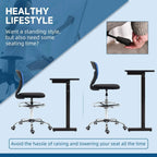 Dark blue mesh-backed armless drafting chair with black seat, chrome base and foot ring