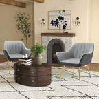 Light grey velvet accent chair with curved arms, vertical channel upholstery, gold steel legs
