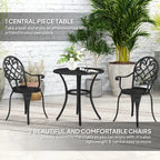 Black three-piece garden bistro set on patio: round table and two scroll-back chairs